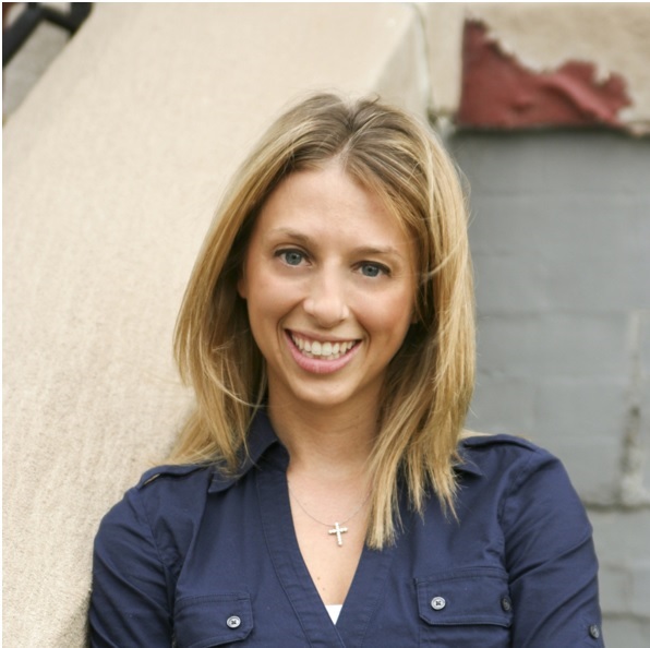 A picture of Christina Marsack-Topolewski. She has long blond hair and is wearing a blue blouse.